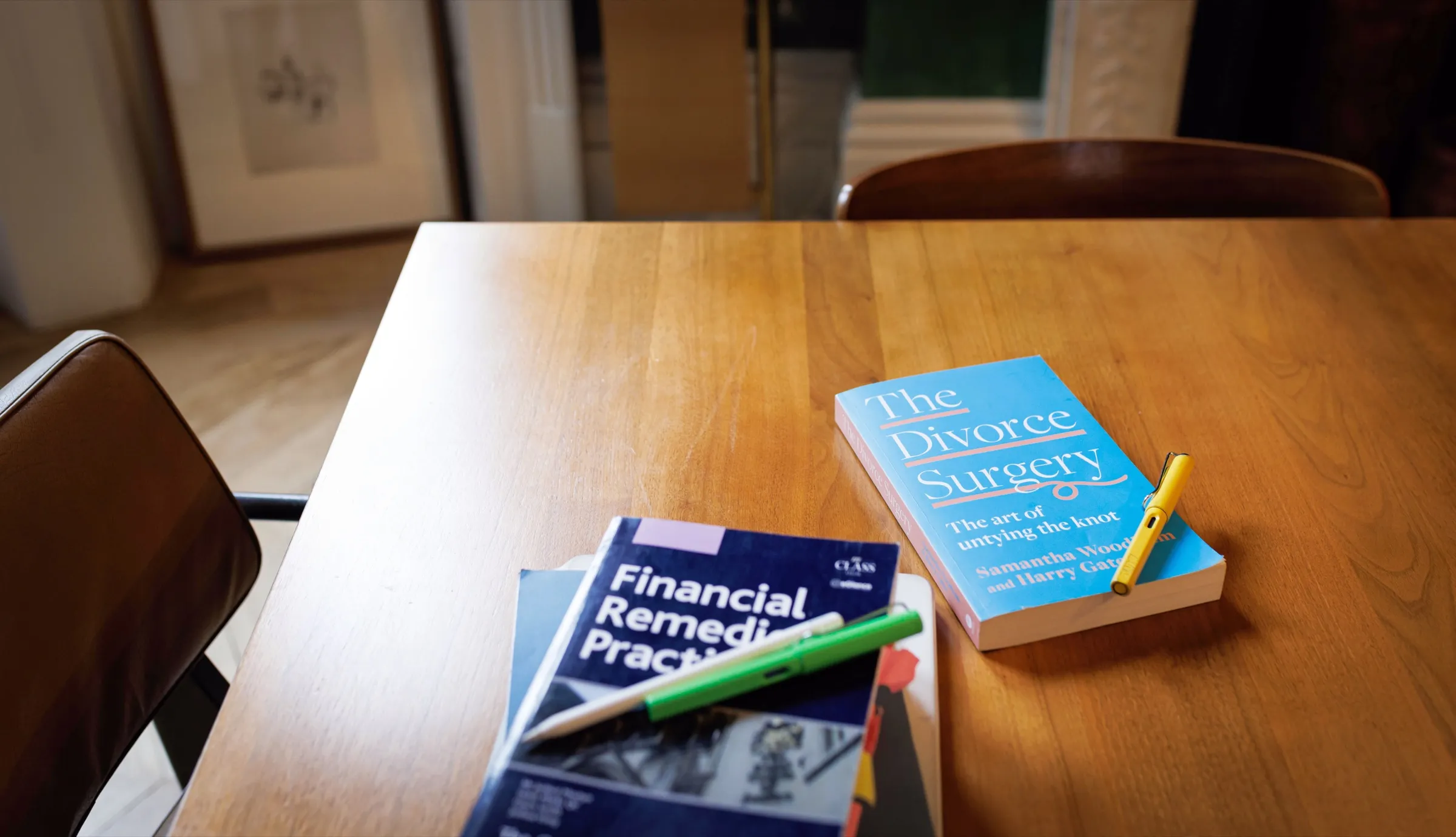 The Divorce Surgery book and a Financial Remedies Practice guide on a wooden table
