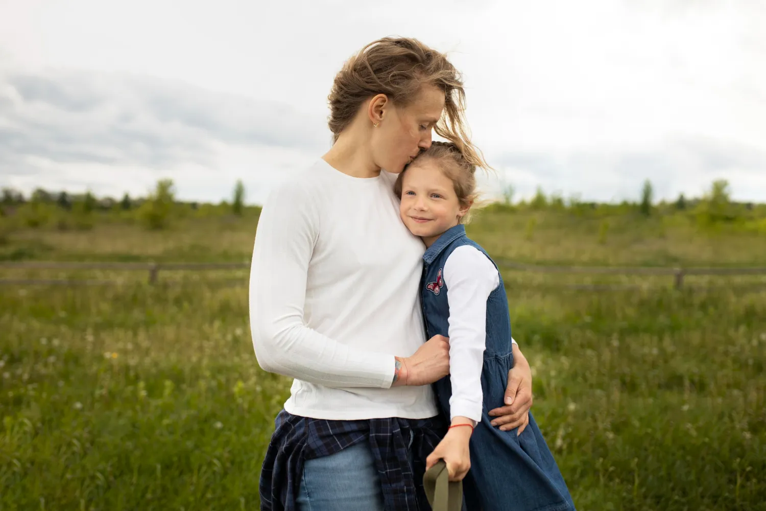 Parent holding and comforting their child, reflecting changes to the presumption of parental involvement in child contact cases.