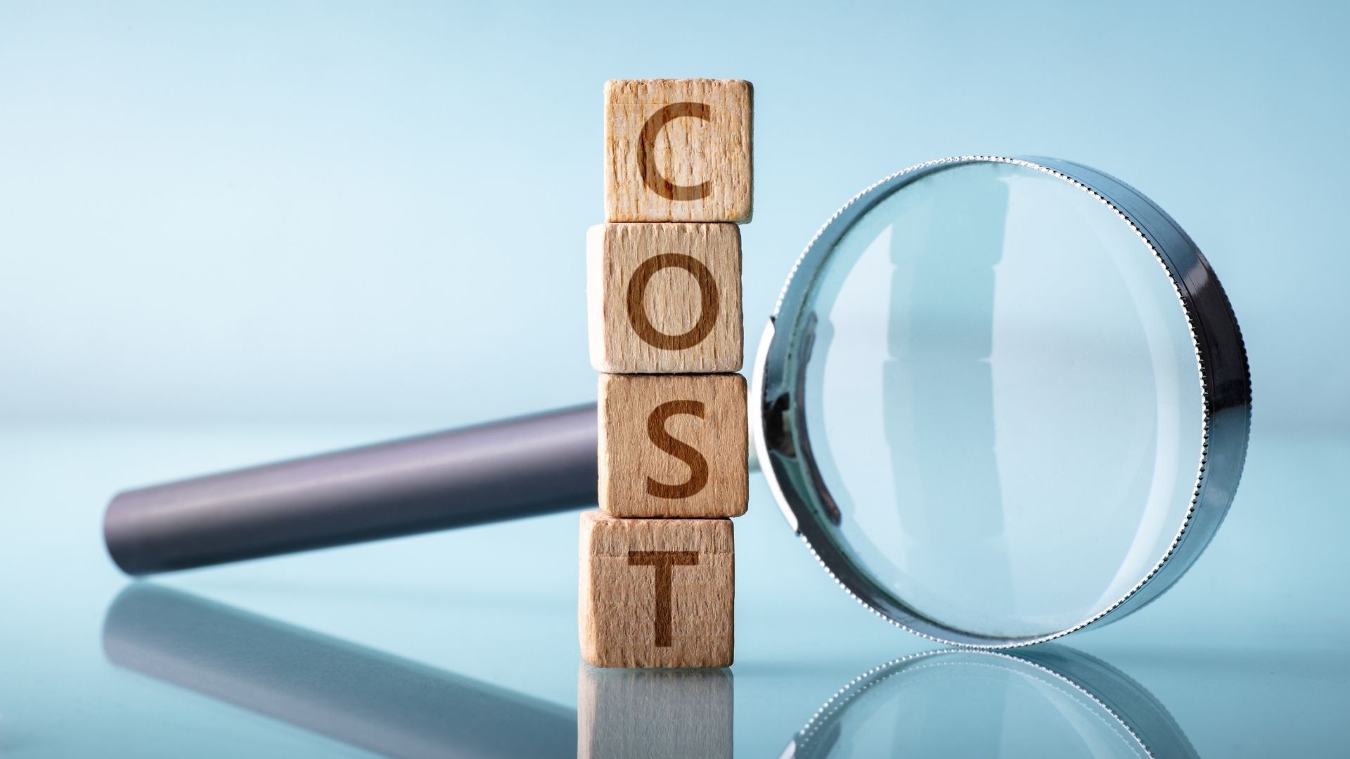 Magnifying glass highlighting the cost of amicable divorce